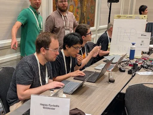 Working with Technical University of Munich (TUM) colleagues at the IETF 126 Hackathon, Vienna, 2026