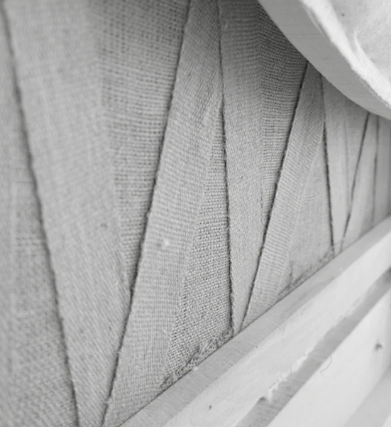 Material composition detail with wood and fabric textures in interior design