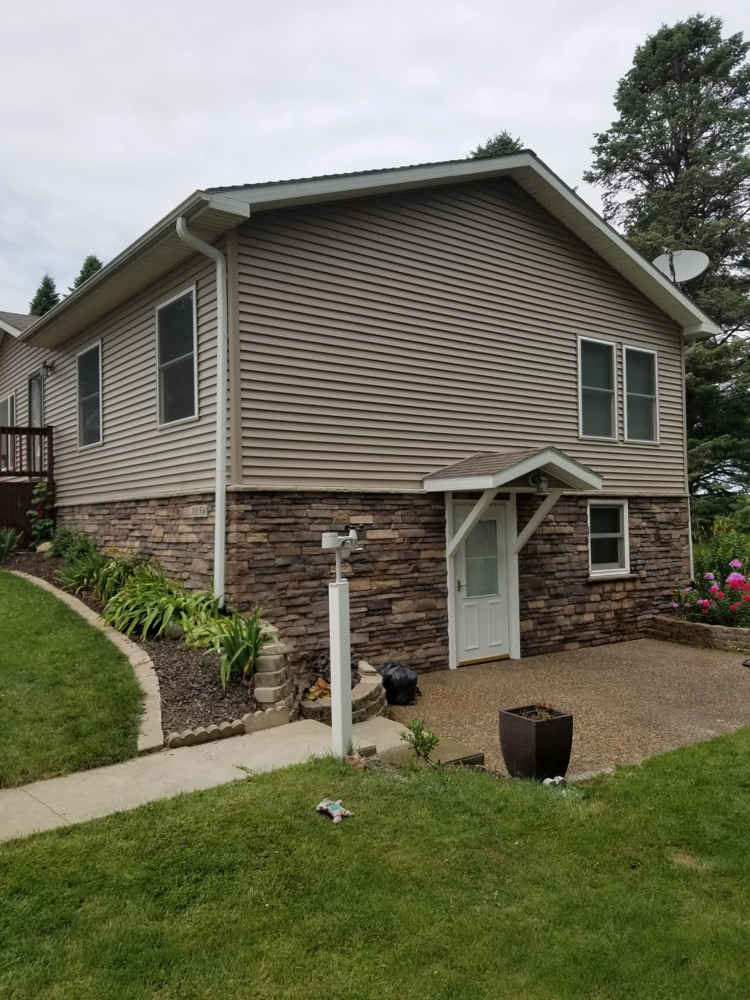 New siding, windows and cultured stone