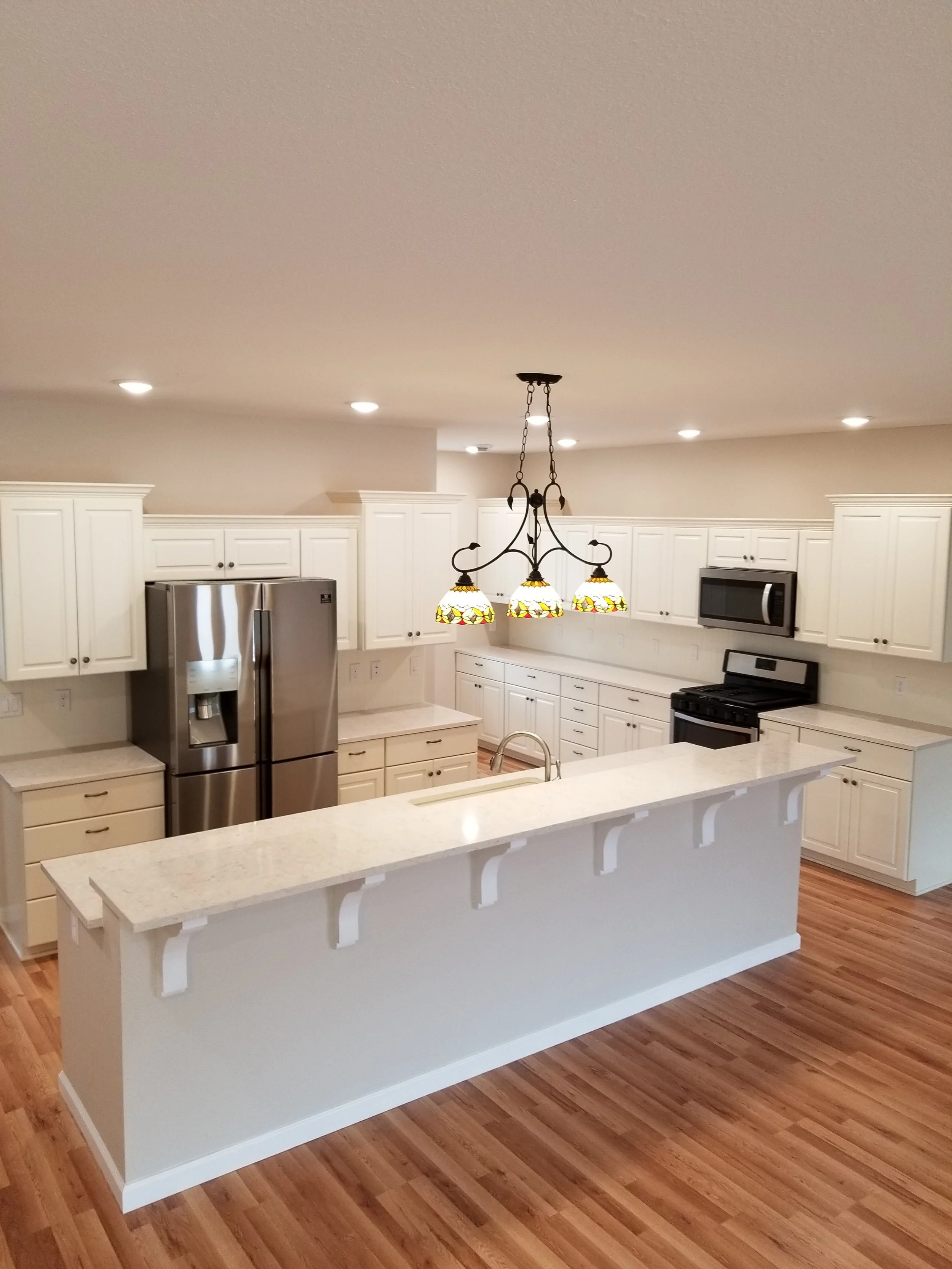 White kitchen with quartz counter tops