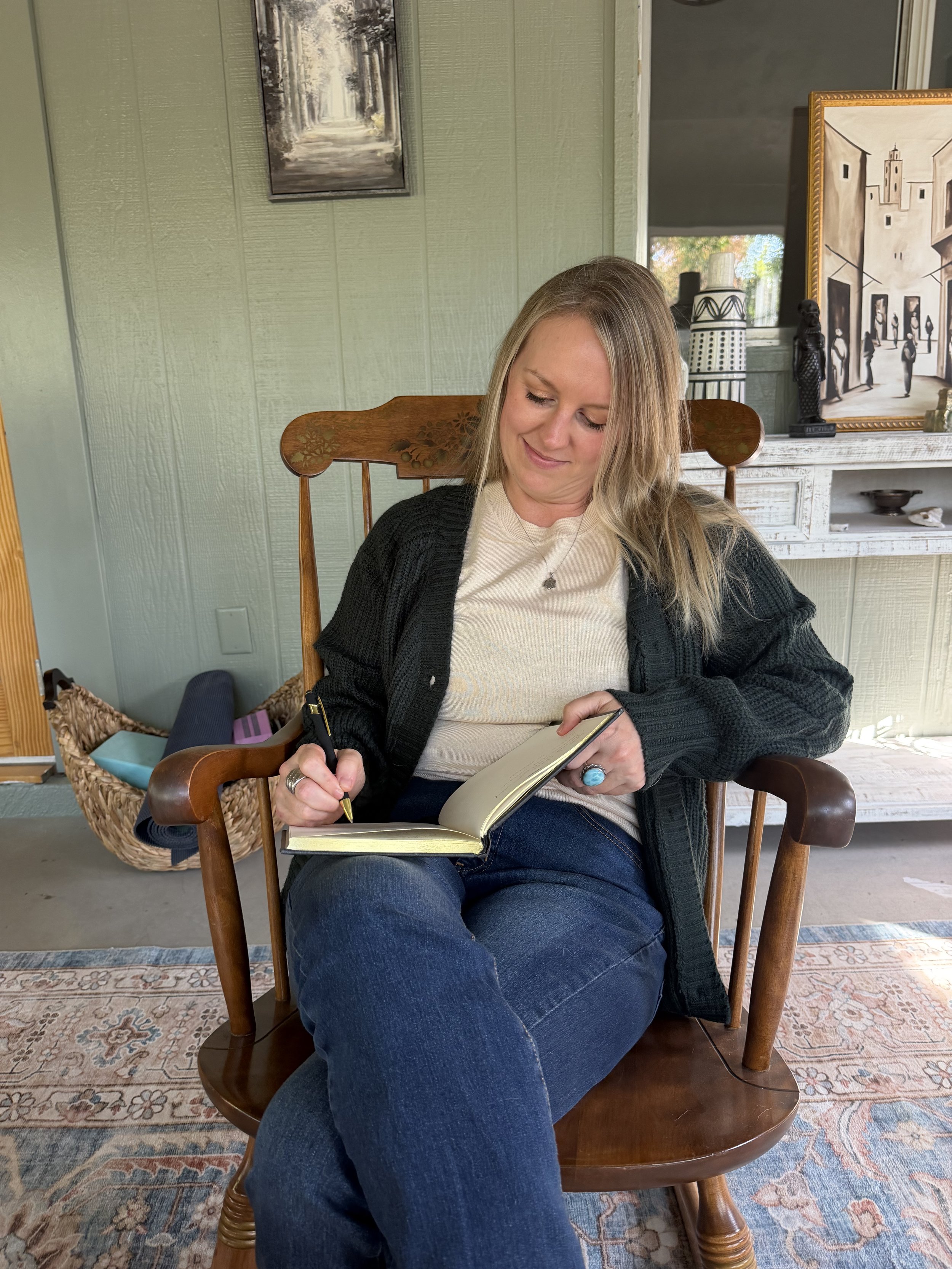 A Therapist for High Performers, executives and Creatives writing in her journal about how to work with chronic burnout