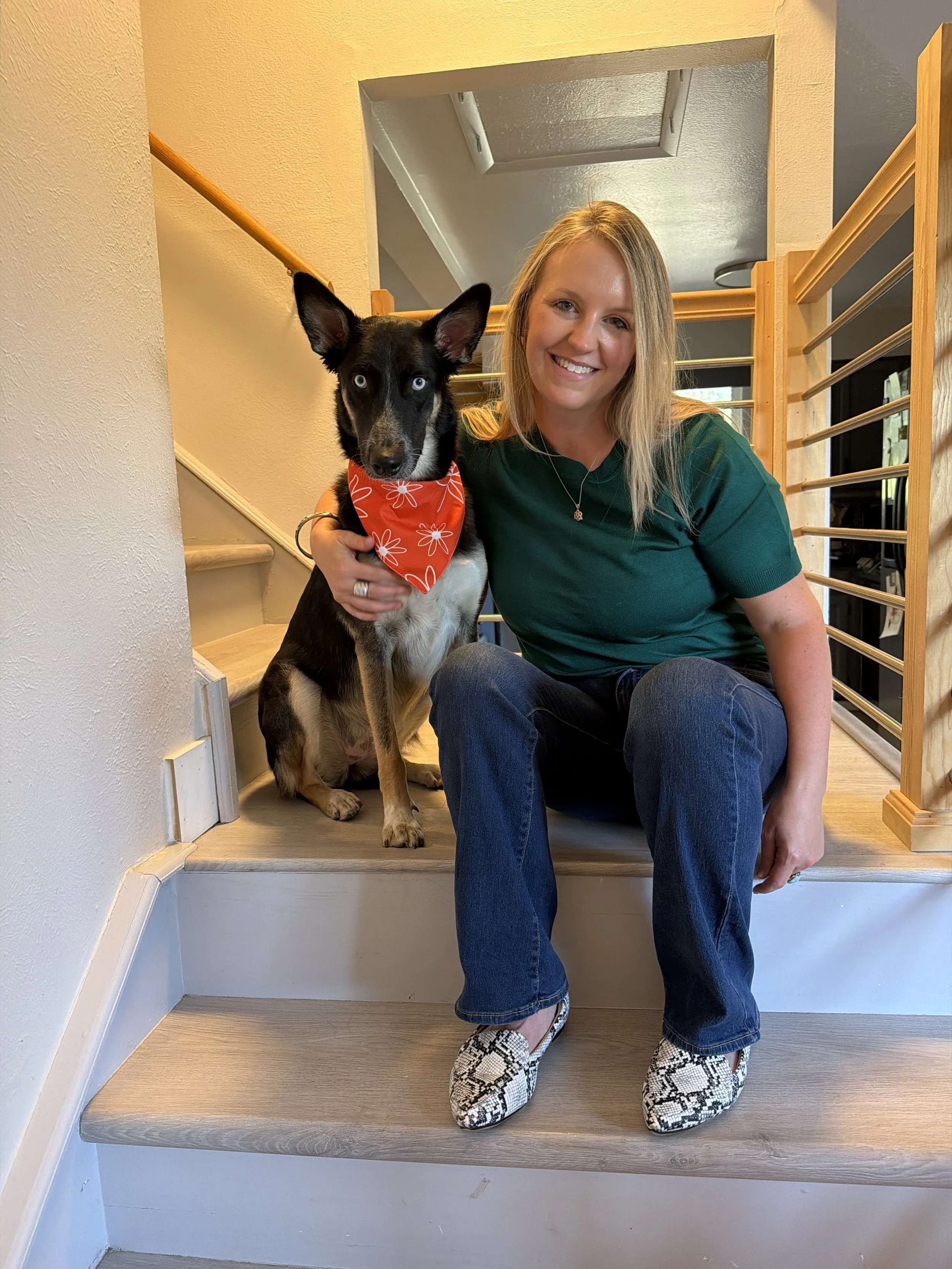Holistic Therapist smiling with therapy dog in San Francisco