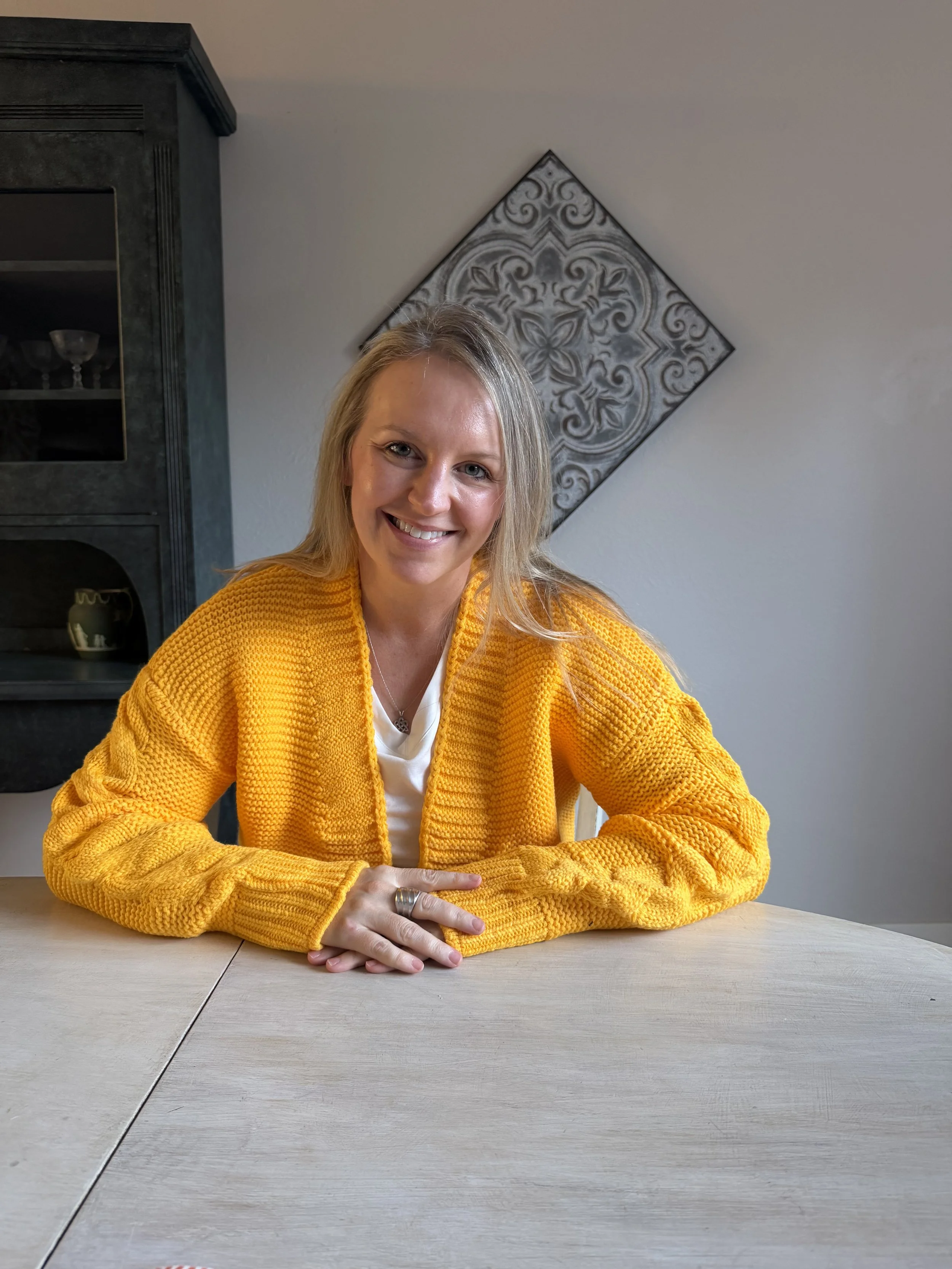 A trauma-informed attachment therapist helping high achieving professionals reclaim balance using grounded support and somatic approaches