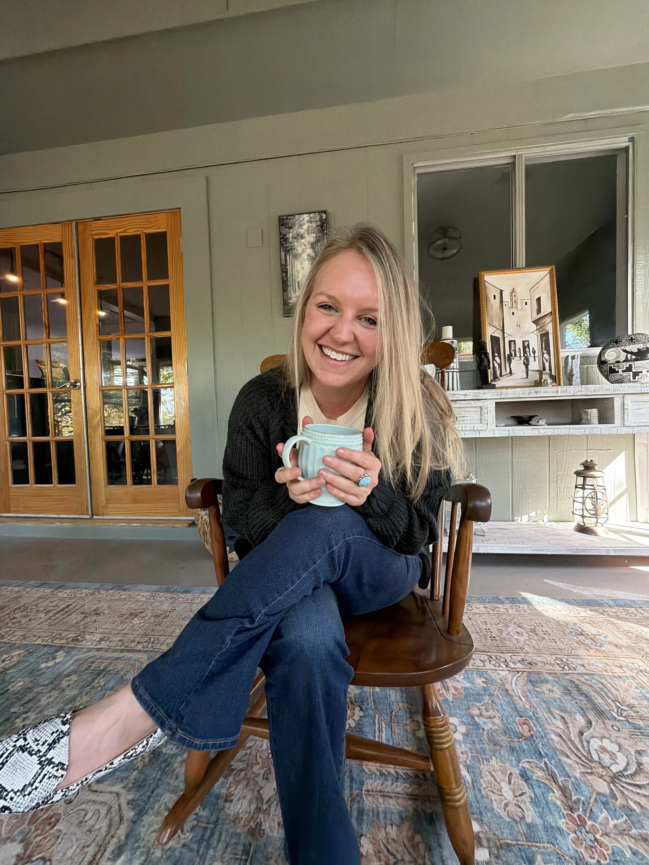 Attachment Therapist laughing and drinking coffee while talking about holistic therapy and Perimenopause