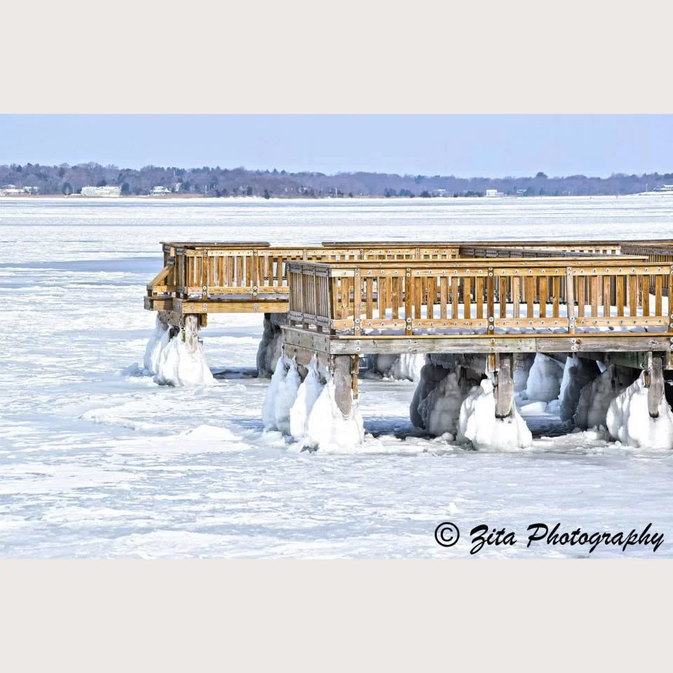 Photograph of Colt State Park dock in Bristol, RI frozen from a recent major storm