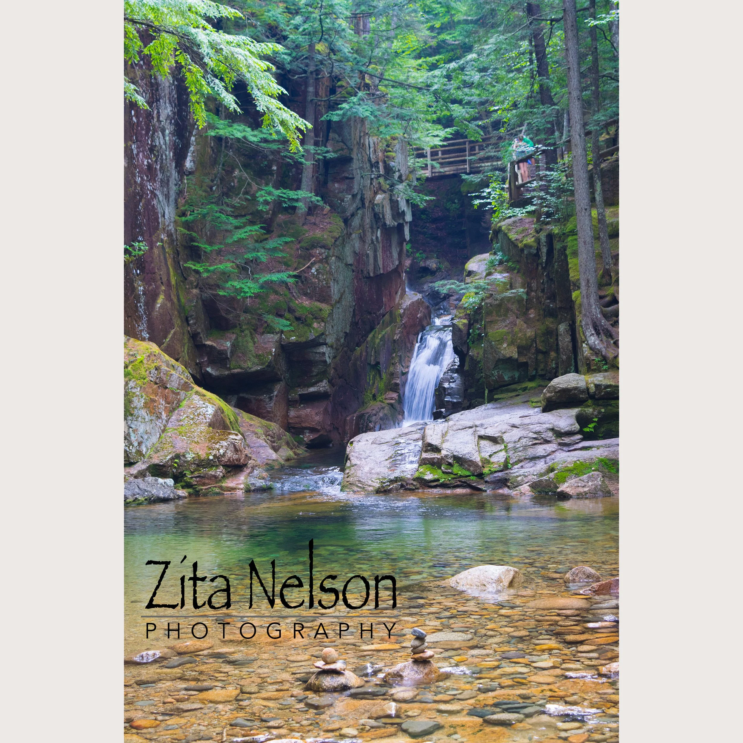 Photograph of waterfall in the forest in NH
