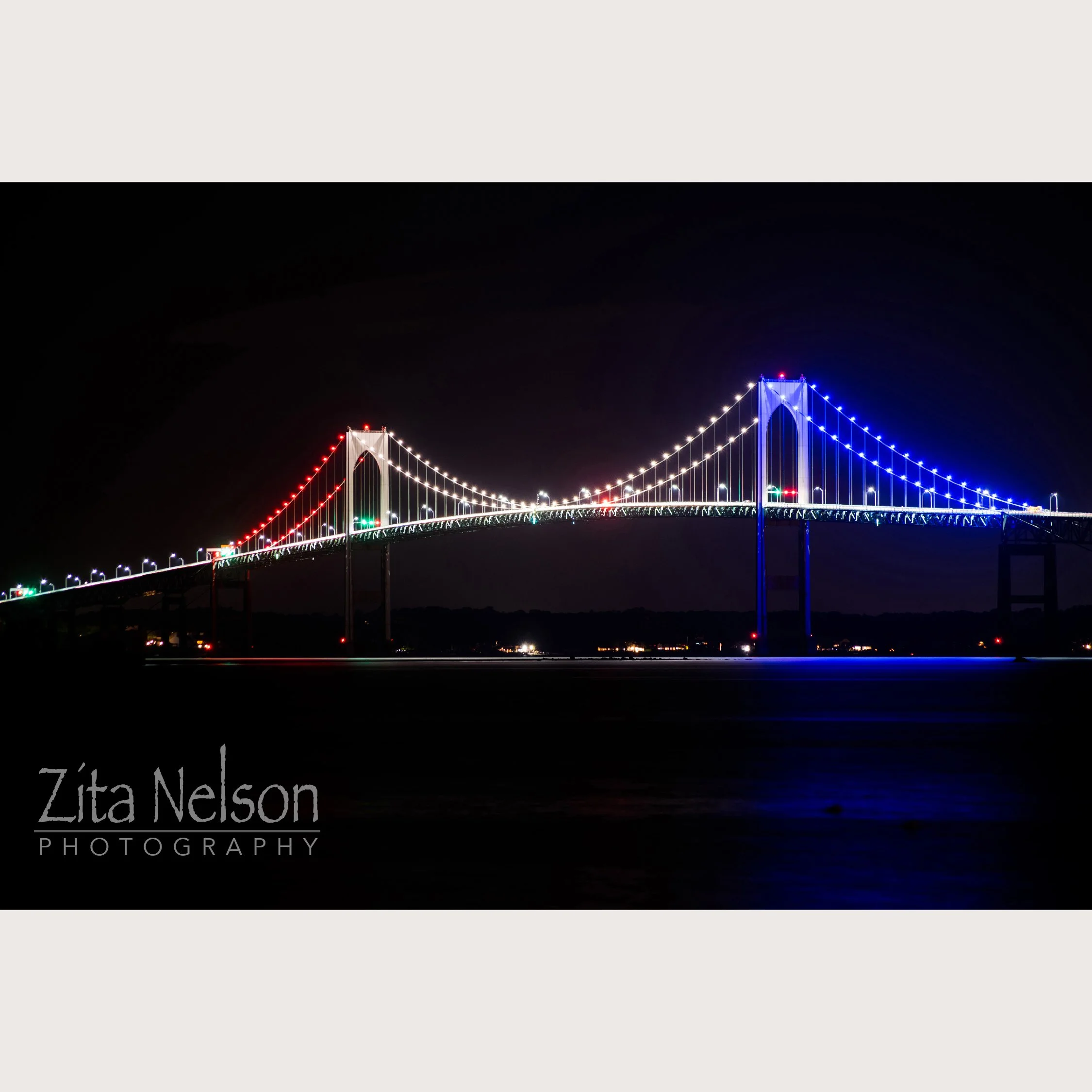 Newport Bridge at Night with Red White and Blue Lights