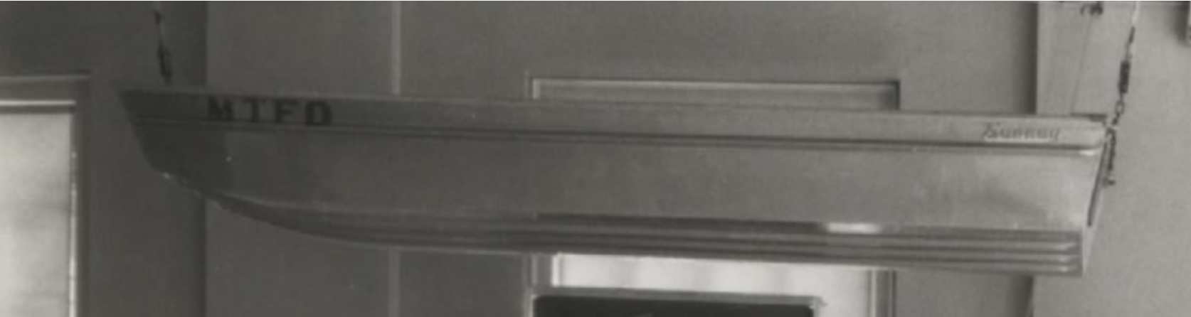 Close-up of a metal door with the word 'SUMMARY' written on it in capital letters.