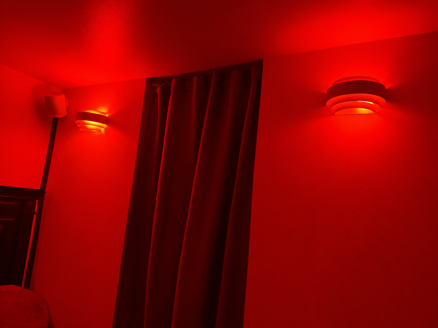 Cinematic Red-Lit Room with Layered Sconces.png