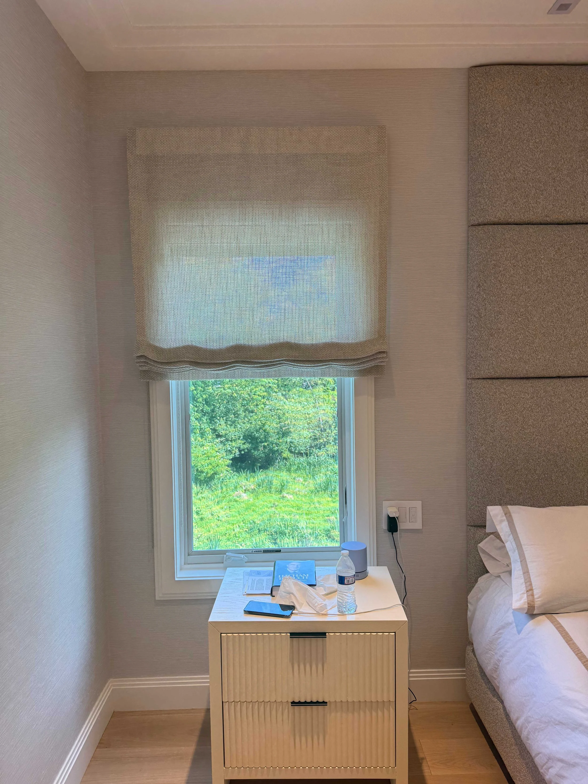 relaxed-linen-roman-shade-bedroom-grey-headboard-garden-view-nyc.jpg