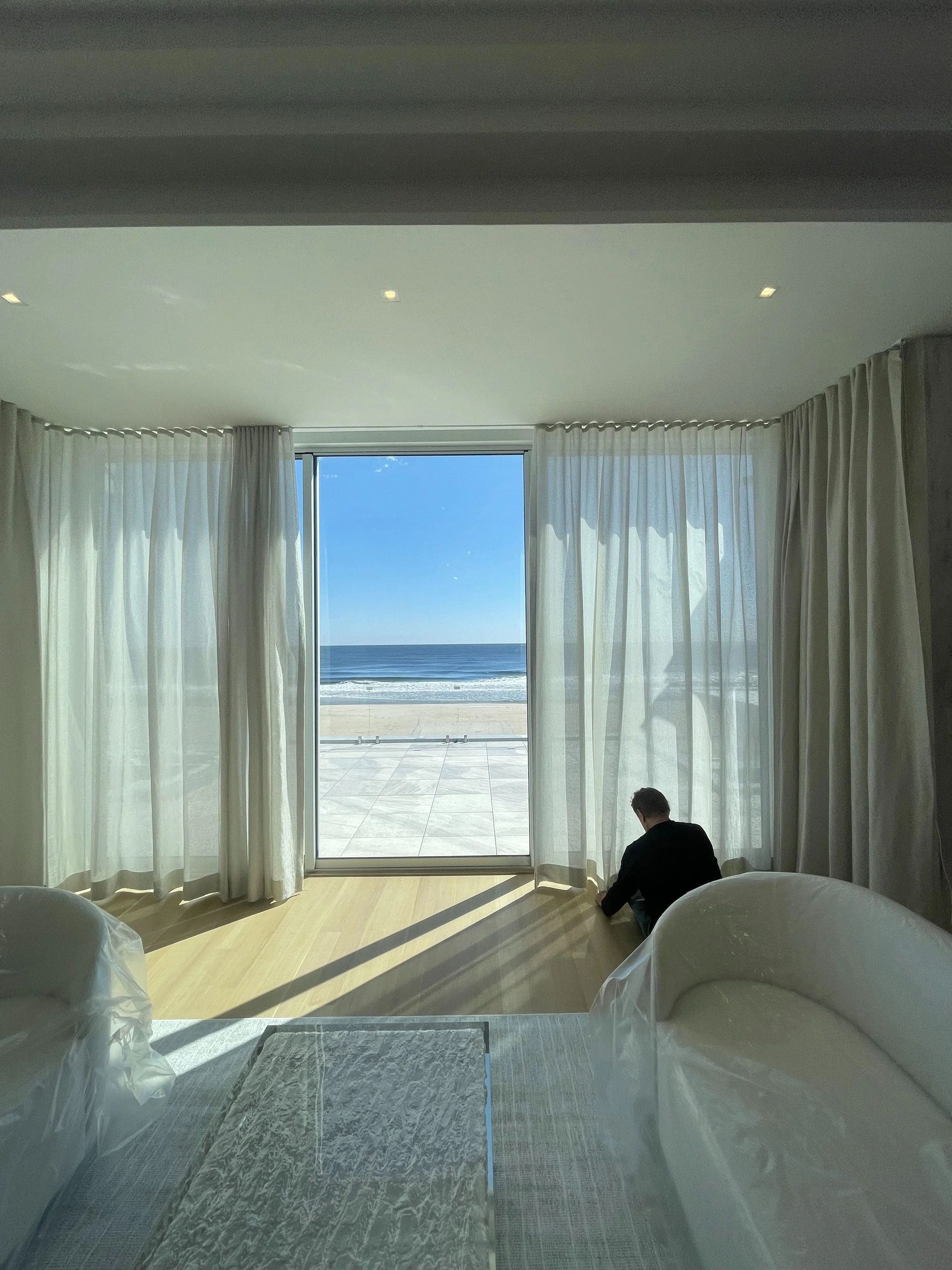 beachfront-bedroom-sheer-linen-drapery-ocean-view-window-installation-nyc.jpg