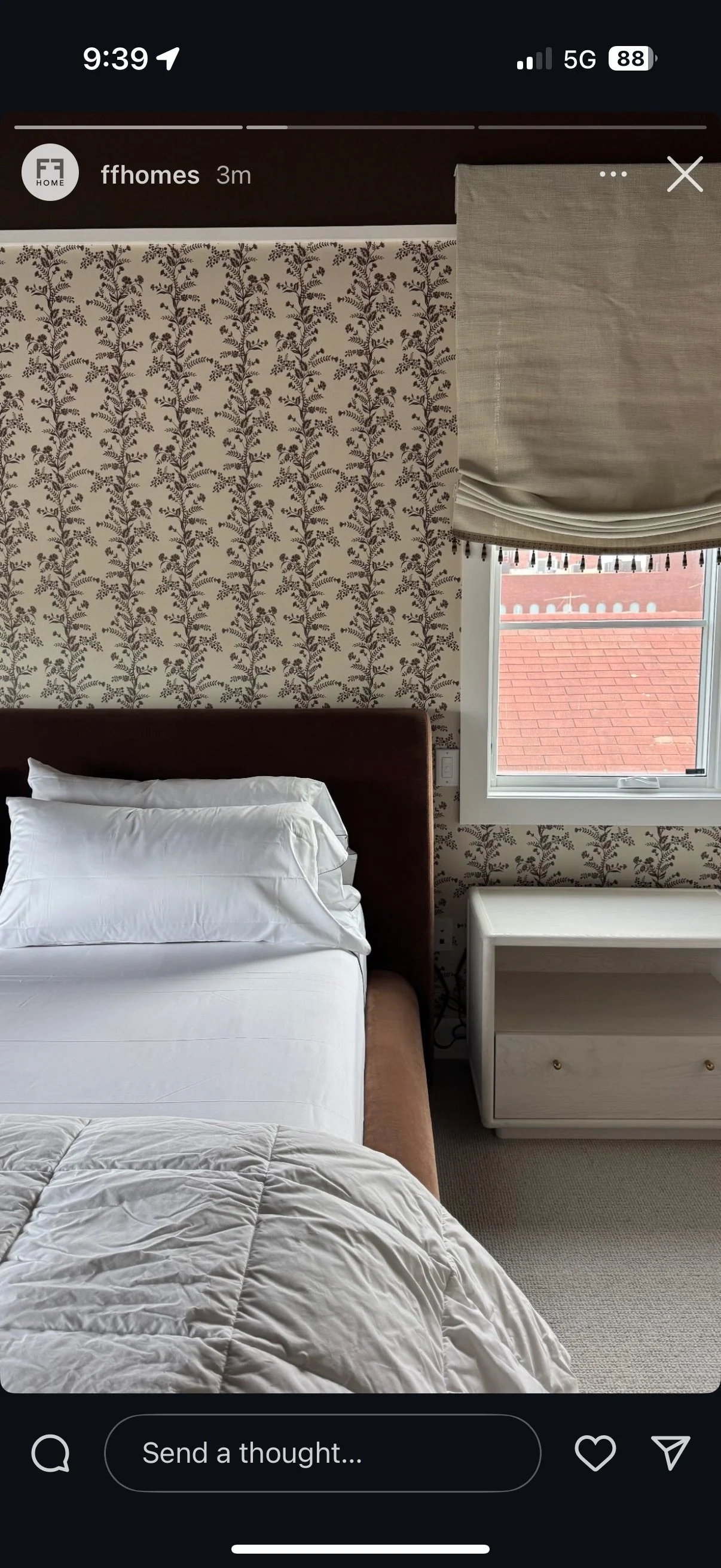 Bedroom with floral botanical wallpaper and tassel-trimmed roman shade, custom window treatment NYC
