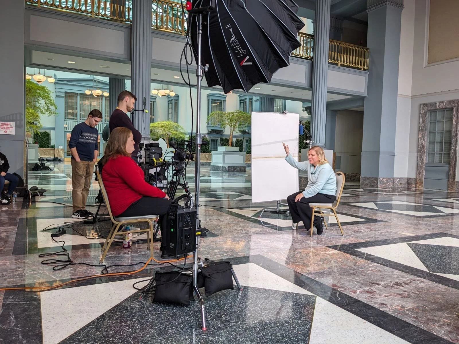 Behind the scenes shot of an interview being filmed by a professional corporate employer branding and talent acquisition video team. 