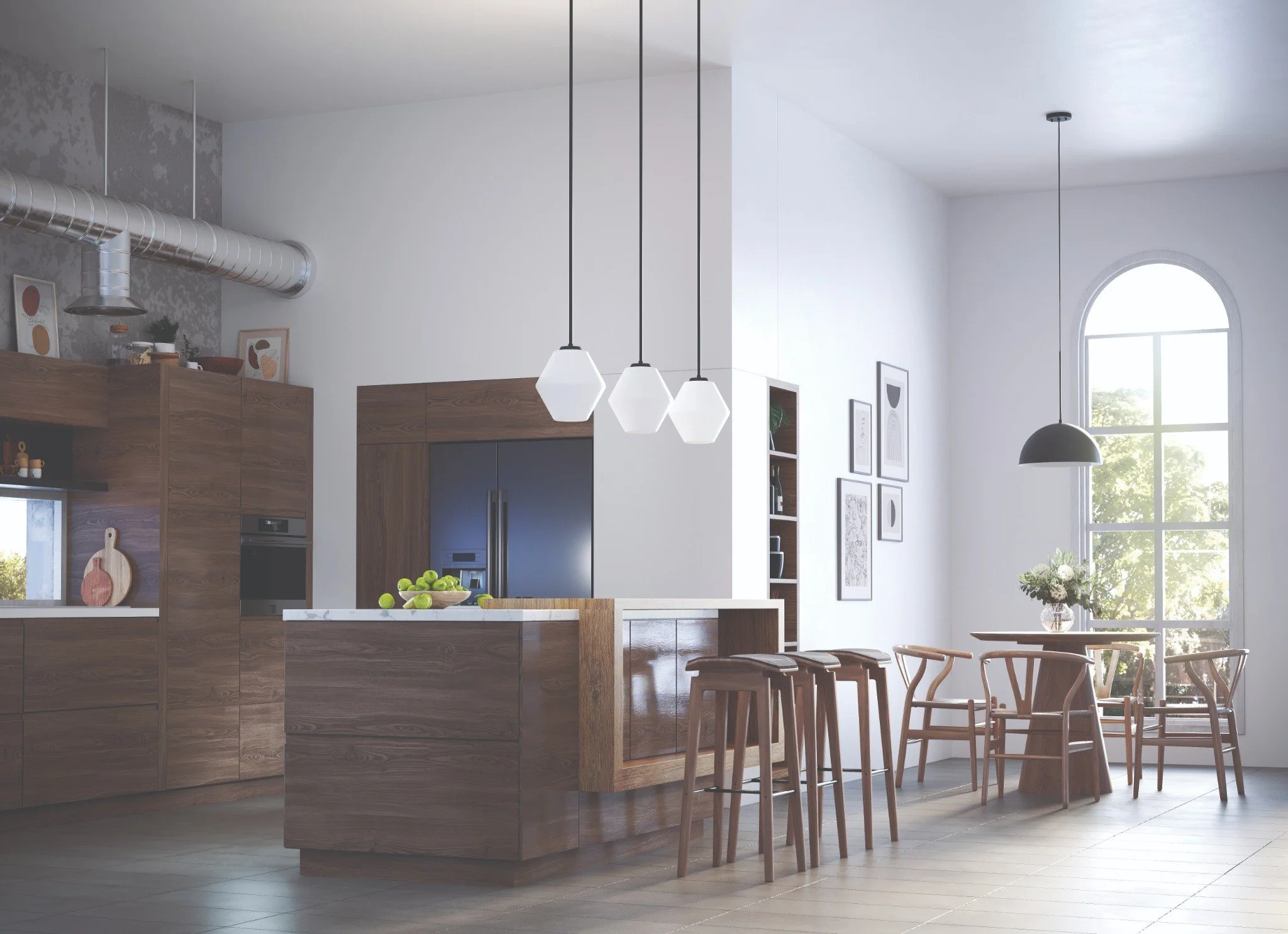A modern kitchen with wooden cabinets, a kitchen island with a bowl of green apples, and hanging pendant lights. The room has large windows with a view of greenery outside, and framed artwork on the white walls.