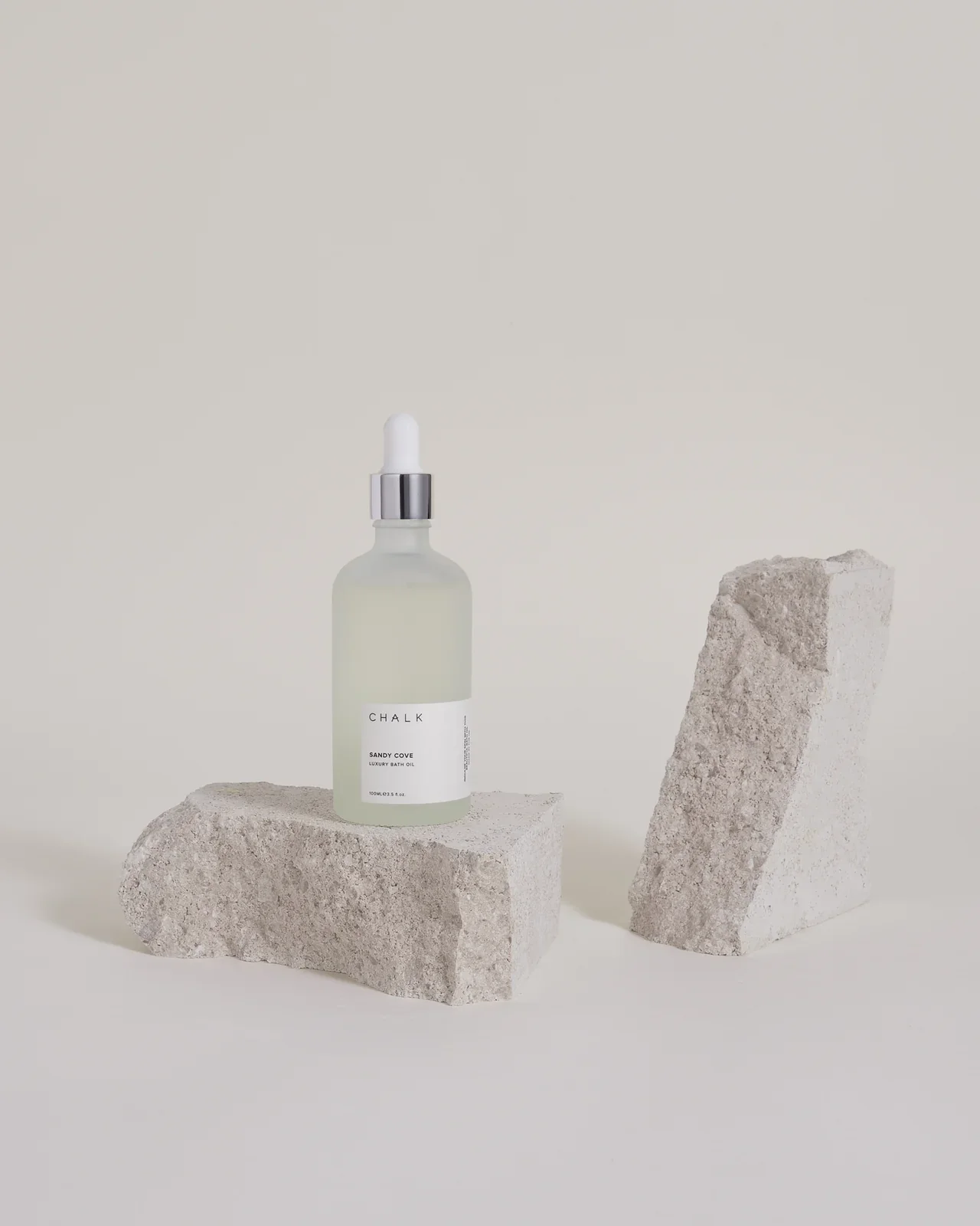 Chalk luxury bath oil sandy cover bottle.webp