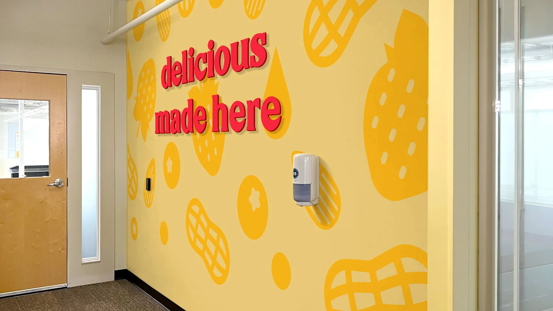 Environmental graphics and typographic design by Hiarki activating a transition space with bold color, pattern, and brand voice.