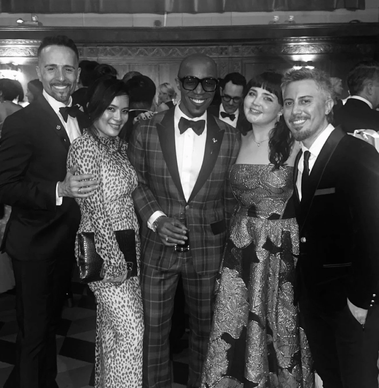 Group of Corey Damen Jenkins' interior design team at a formal event, smiling and posing for a photo.