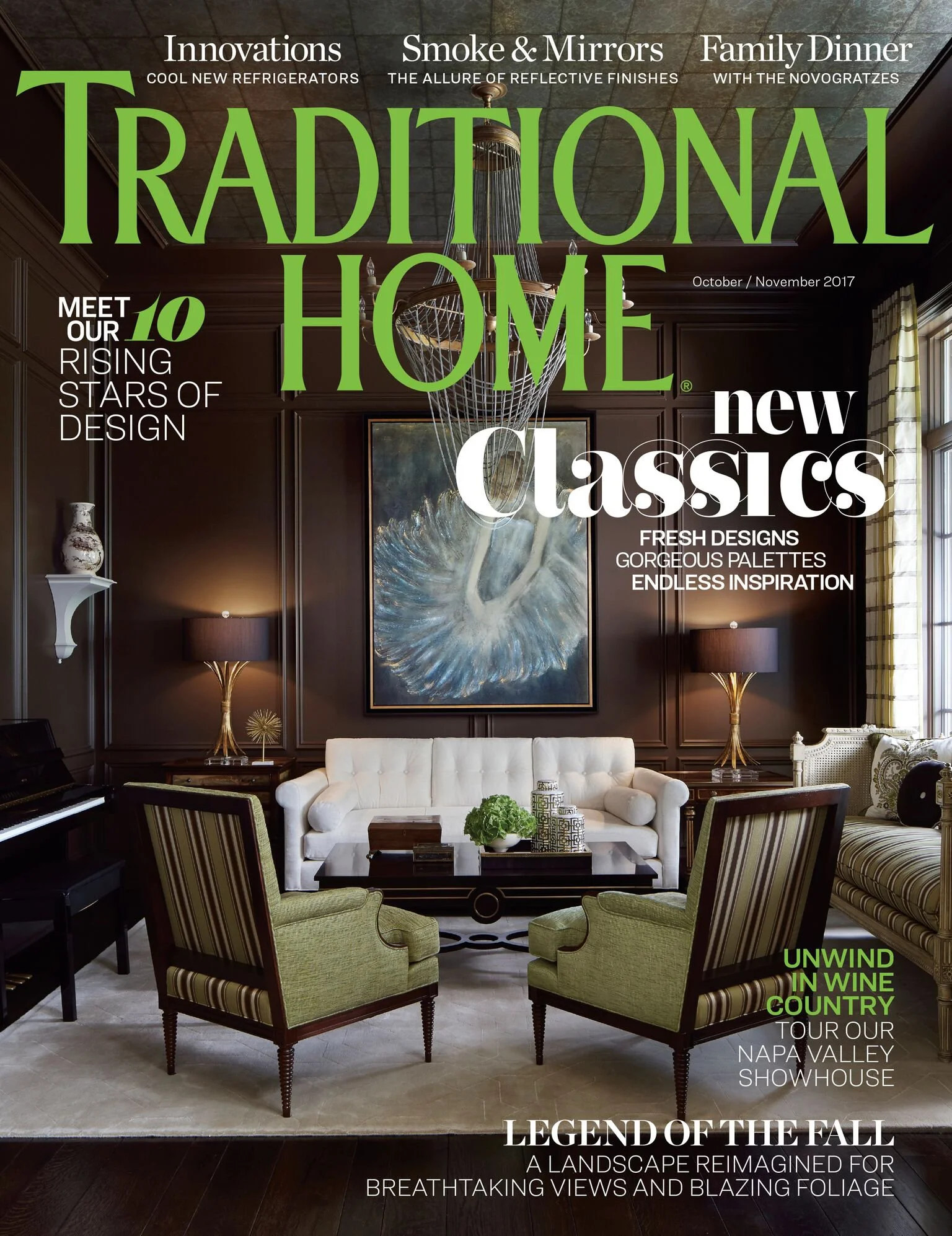 A luxurious living room with dark wood paneled walls, a large abstract painting of a white swan, a white Chesterfield sofa, two green striped accent chairs, a dark wooden coffee table with decorative items, and floor lamps with golden bases. The image is overlaid with magazine-style headlines about home innovations, design, and touring Napa Valley, with a focus on interior decor and landscape scenery.