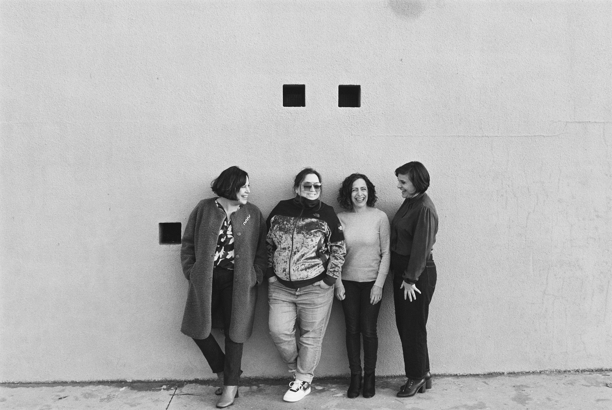 Penny and three clients jumping for joy ate the wrap of their brand shoot in Barcelona with Johan Kramer