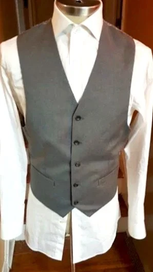 White dress shirt and a gray vest.