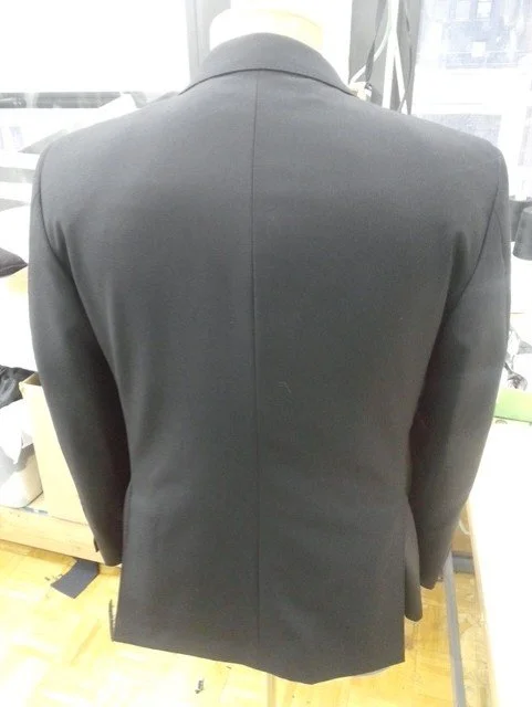 Back of a black suit jacket 