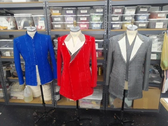  Colorful suits—blue, red, and gray