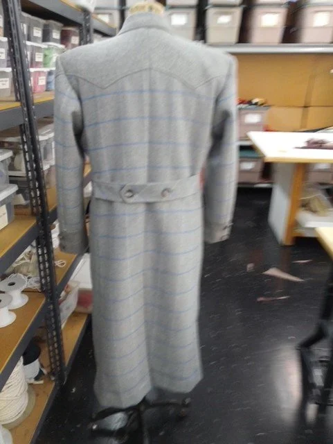 A gray plaid overcoat.