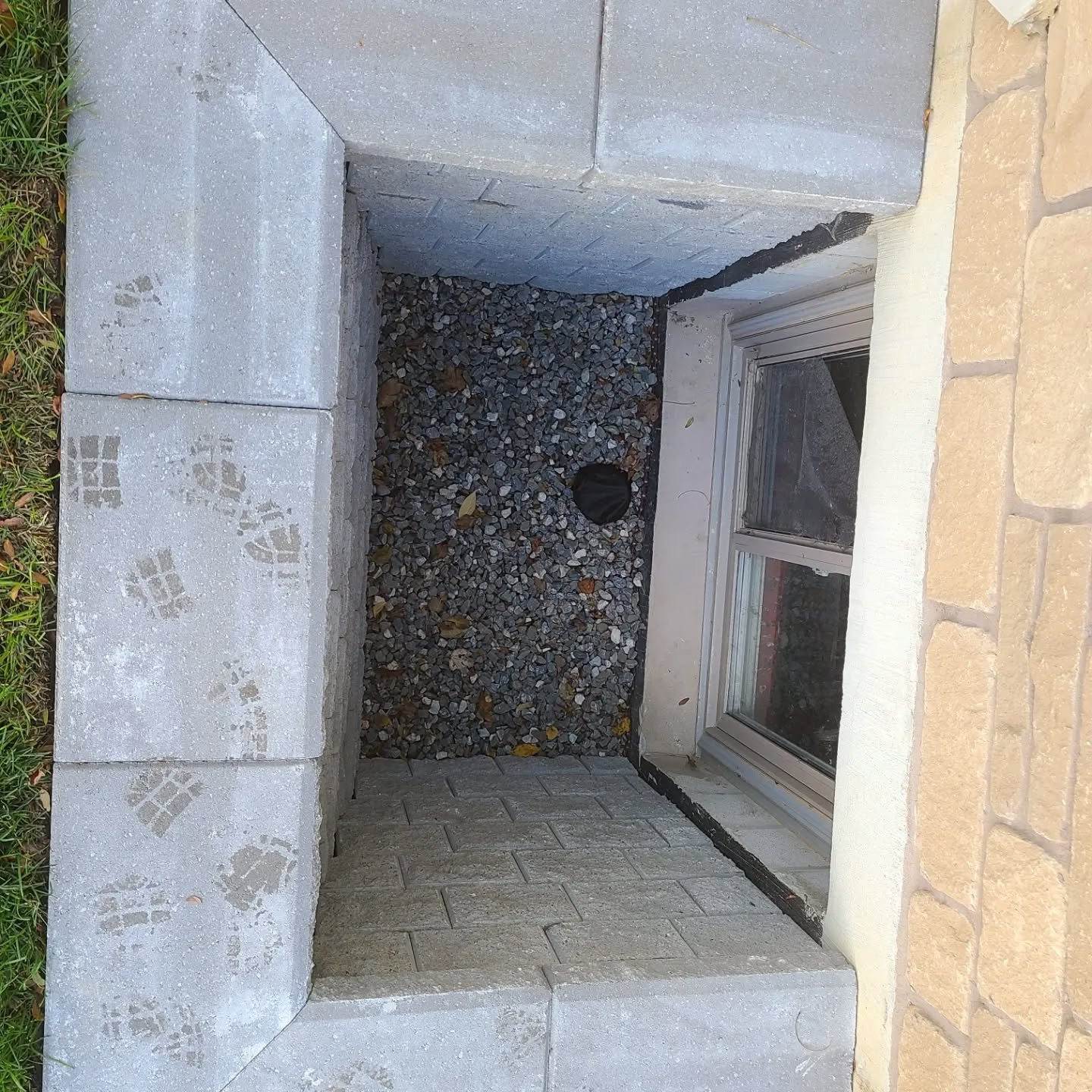 Some new window wells with proper drainage so the basement doesn't flood anymore.  There was a lot of dirt moved to get these in and it looks like we were never there.