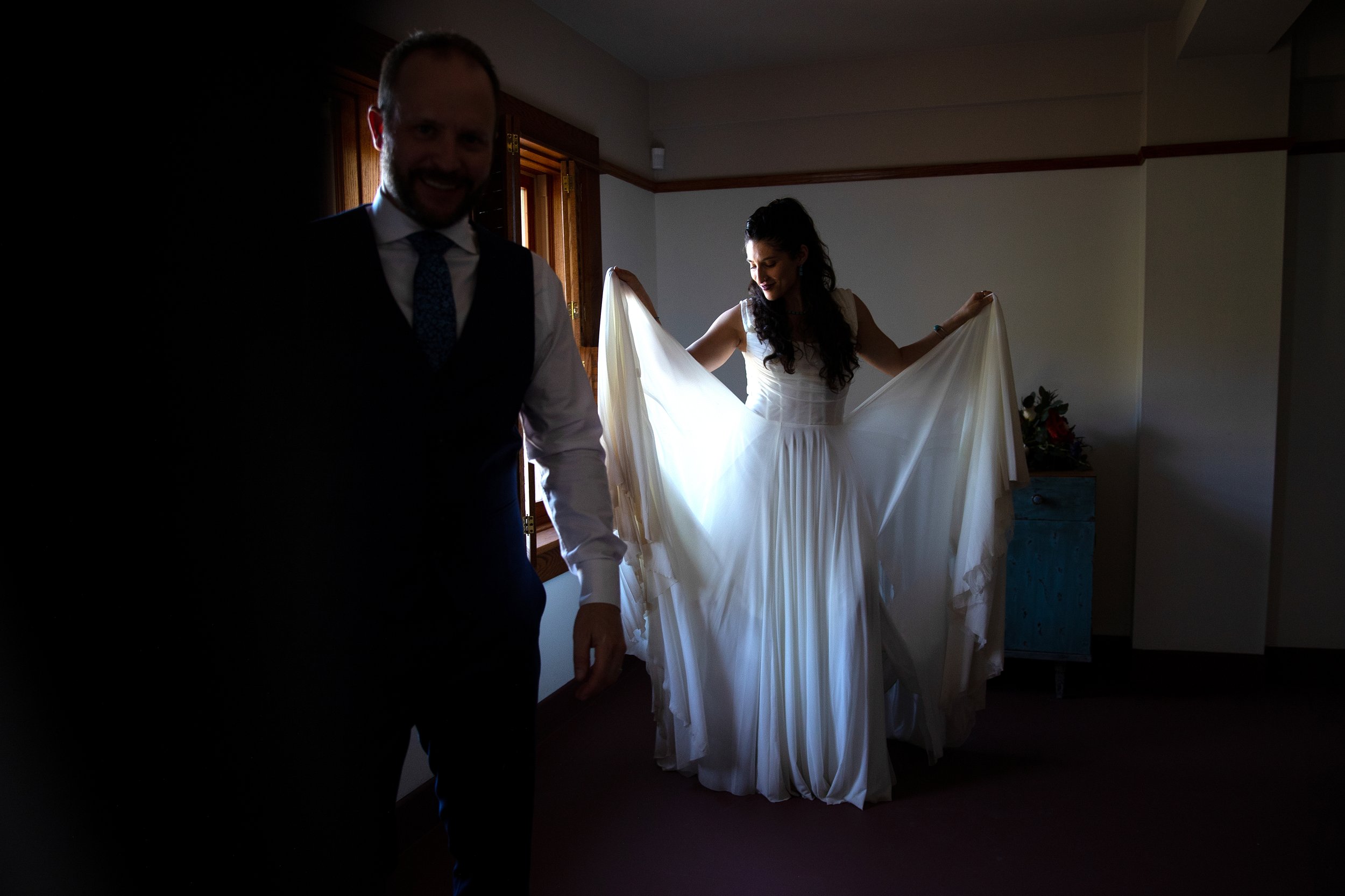 A woman in a white wedding dress before her wedding ceremony at the Little Daisy in Jerome, Arizona, photographed by documentary style wedding photographer Megan Farmer, who is based in Seattle, Washington. 