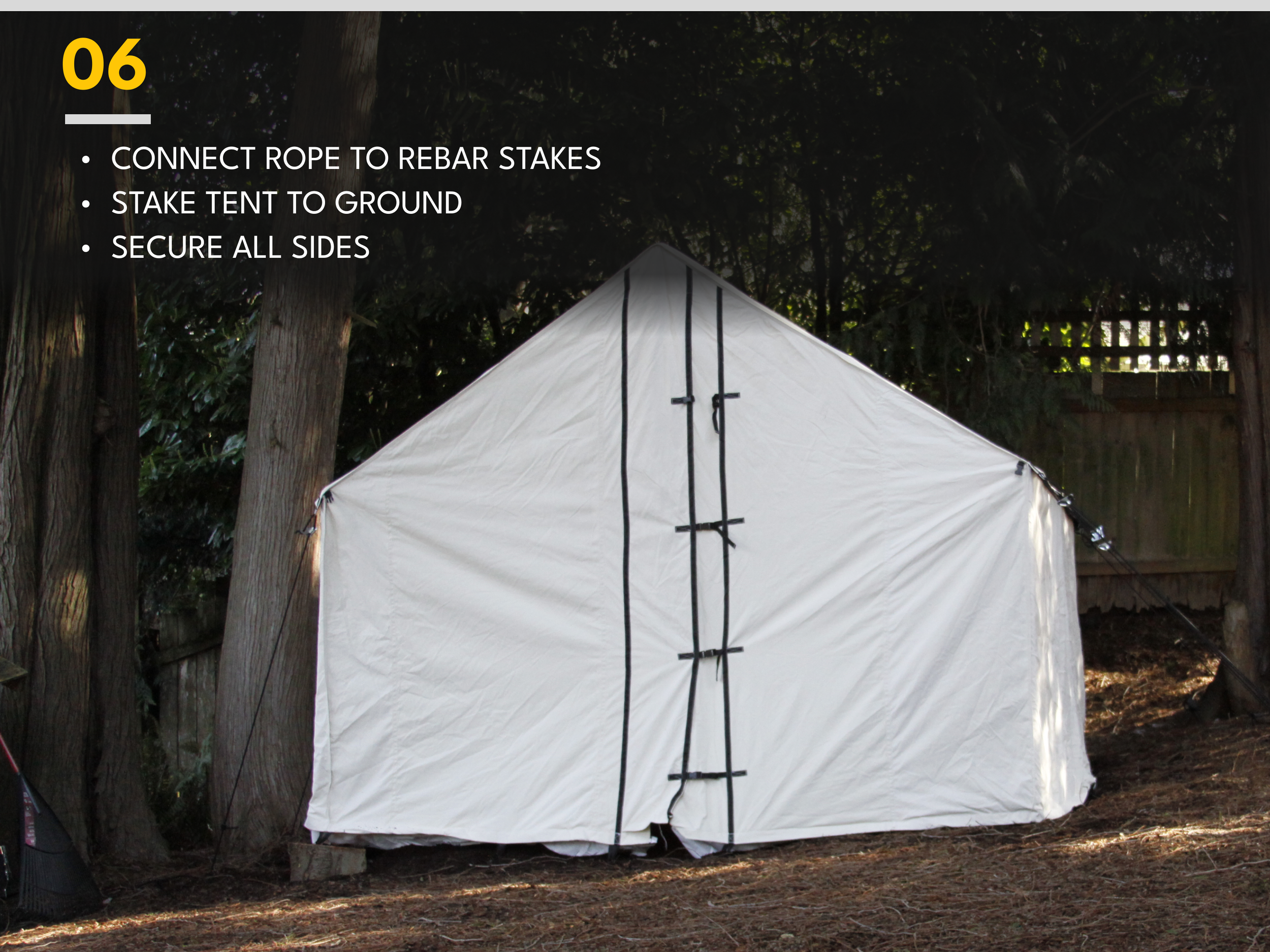 A white tent set up outdoors among trees with black ropes and stakes securing it to the ground. Instructions on the image detail how to connect the rope to rebar stakes, stake the tent to the ground, and secure all sides.