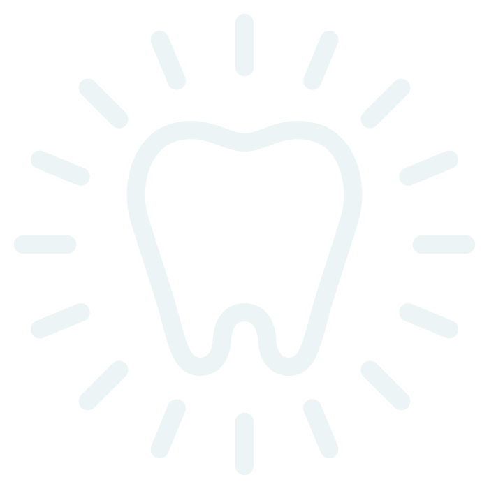 Icon of a tooth with shining rays around it