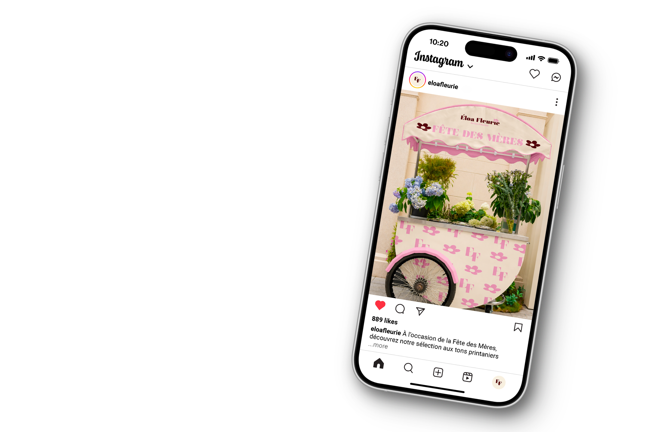 Une image d'un téléphone affichant une publicité pour une fête des mères, avec un stand de fleurs rose et blanc décoré de fleurs colorées.