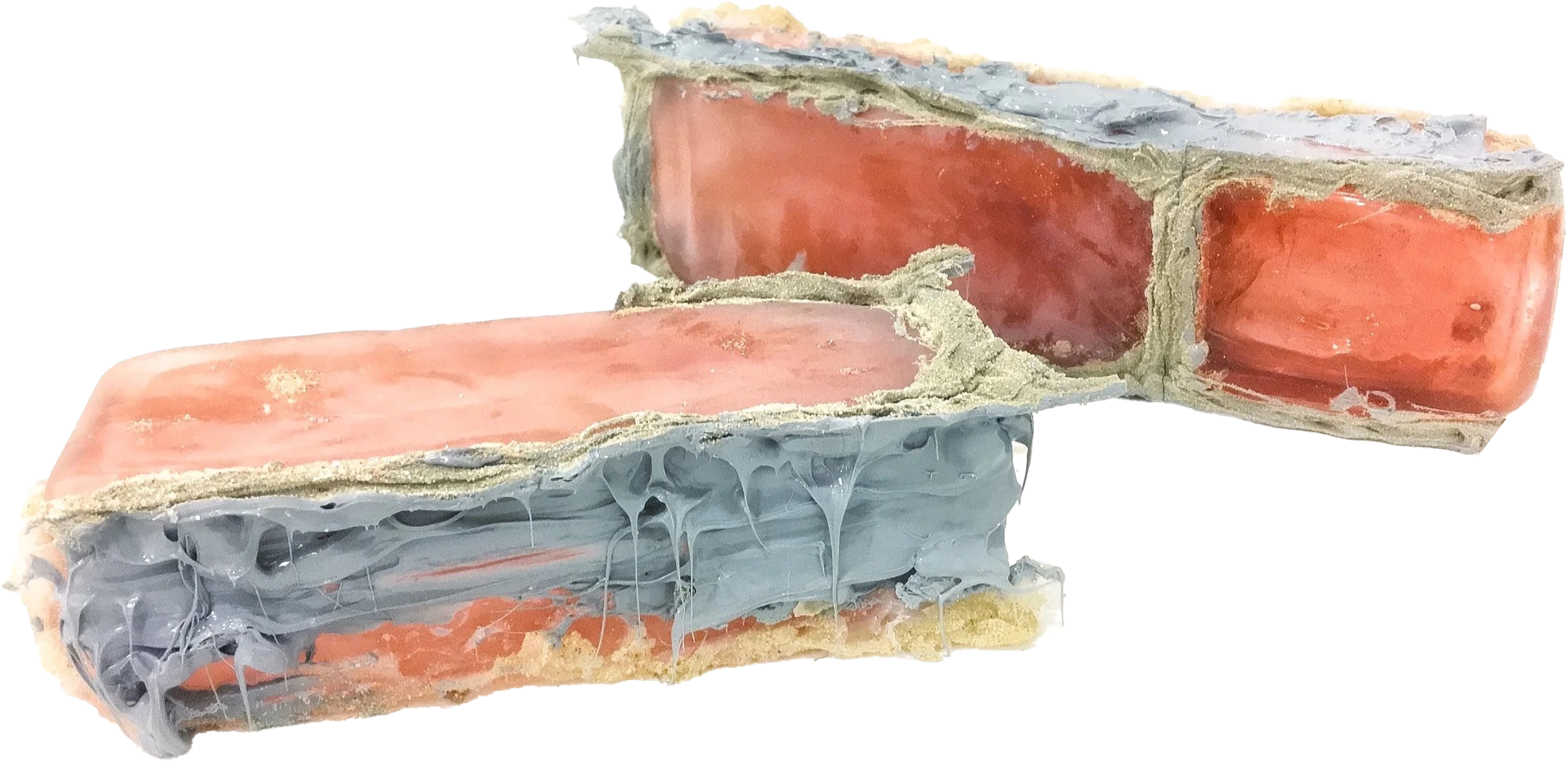 Sculpture of colorful bricks in shades of pink, silver, and purple.