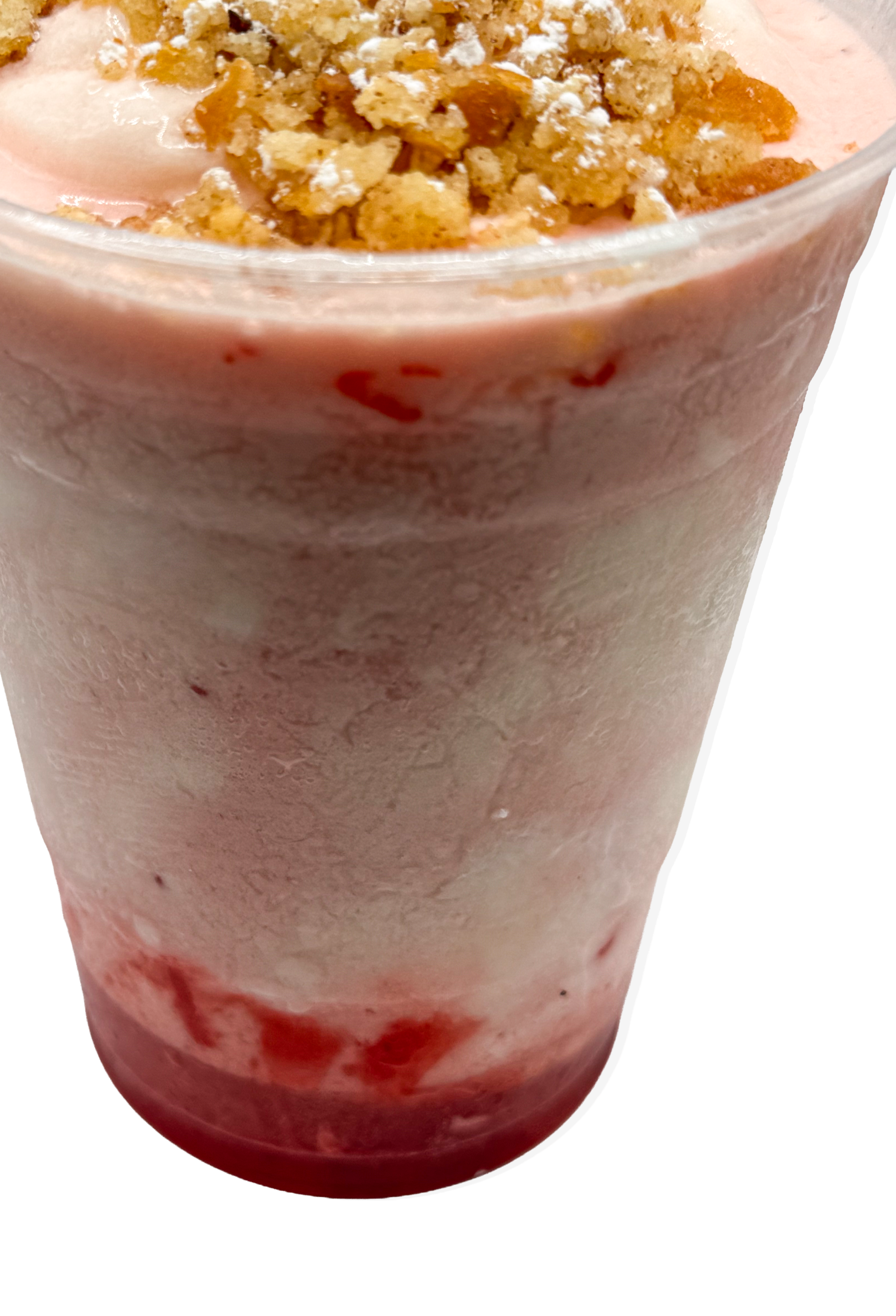 Close-up of a strawberry parfait with whipped cream, topped with crushed graham crackers.