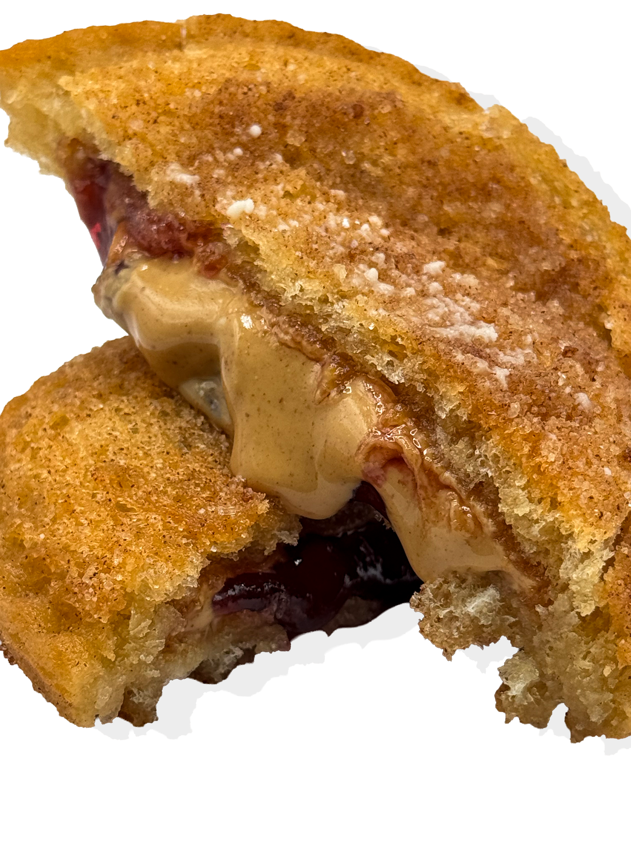 Close-up of a toasted grilled cheese sandwich with melted cheese and dark berry jam in the middle.