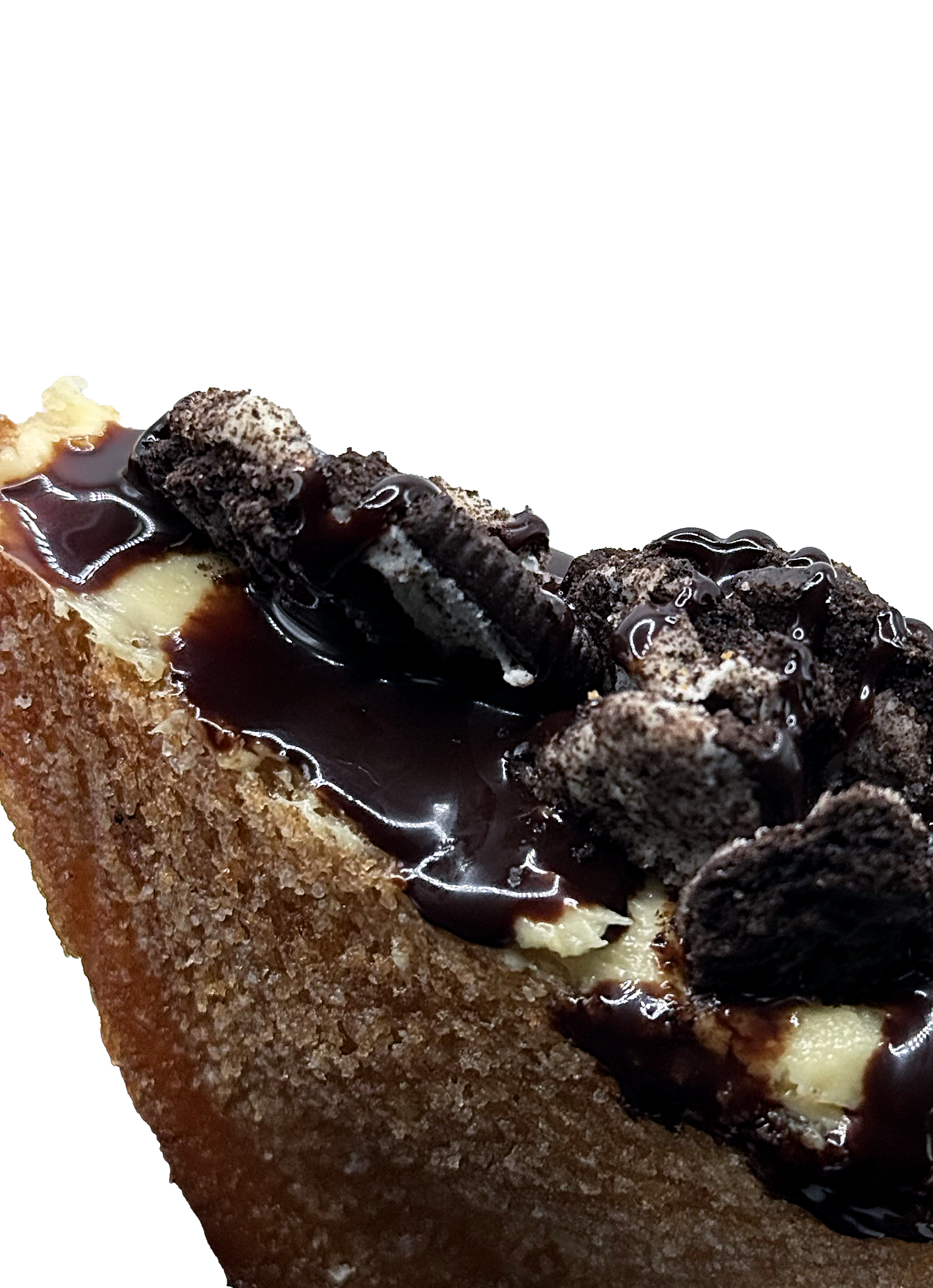 Close-up of a slice of chocolate Oreo cheesecake with Oreo cookies and chocolate drizzles on top.
