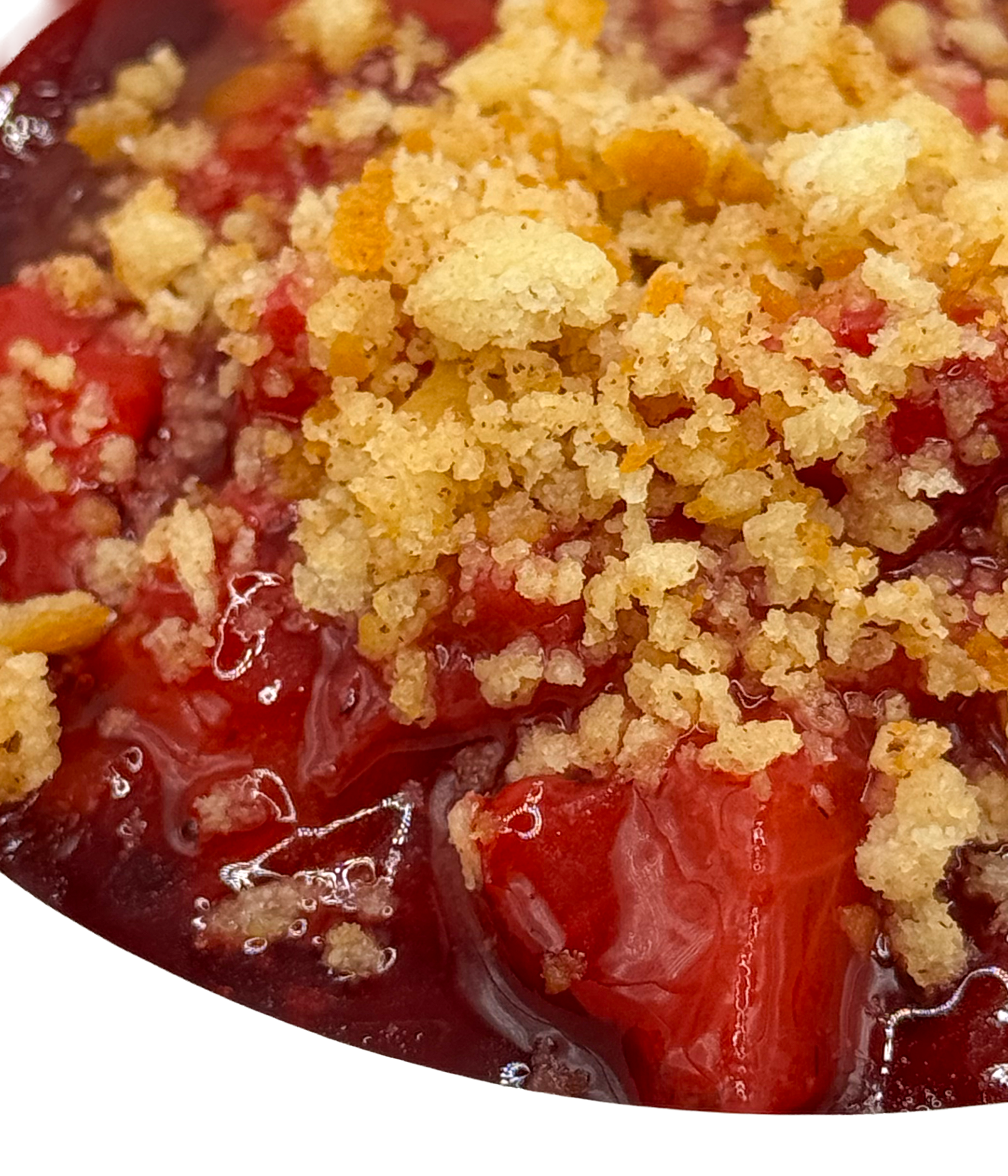 Close-up of cherry pie topped with a crumbly, golden streusel crust.