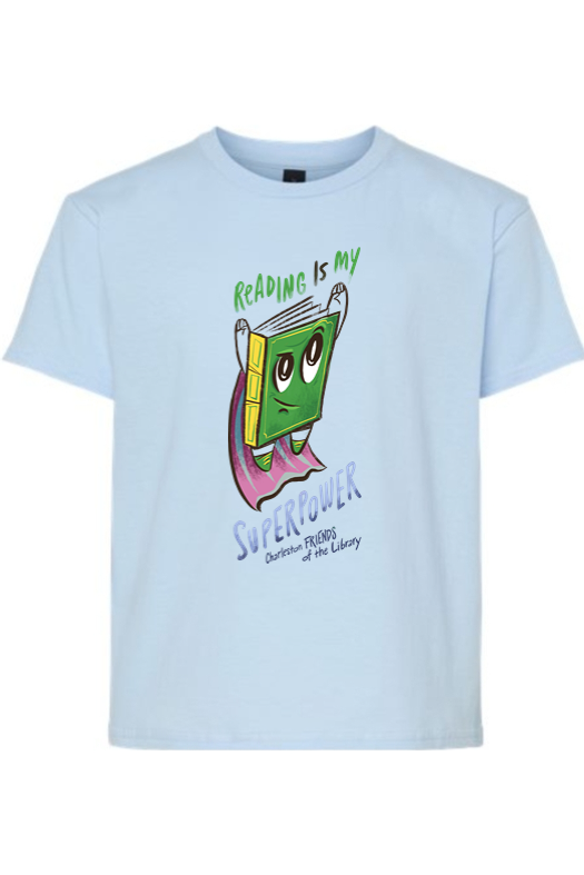 Light blue T-shirt with a cartoon book character wearing a cape, smiling, and the text "Reading is my superpower"