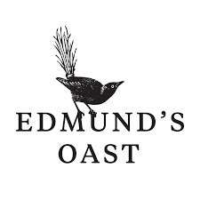 Logo featuring a bird with plant branches in its beak above the text 'Edmund's Oast'.
