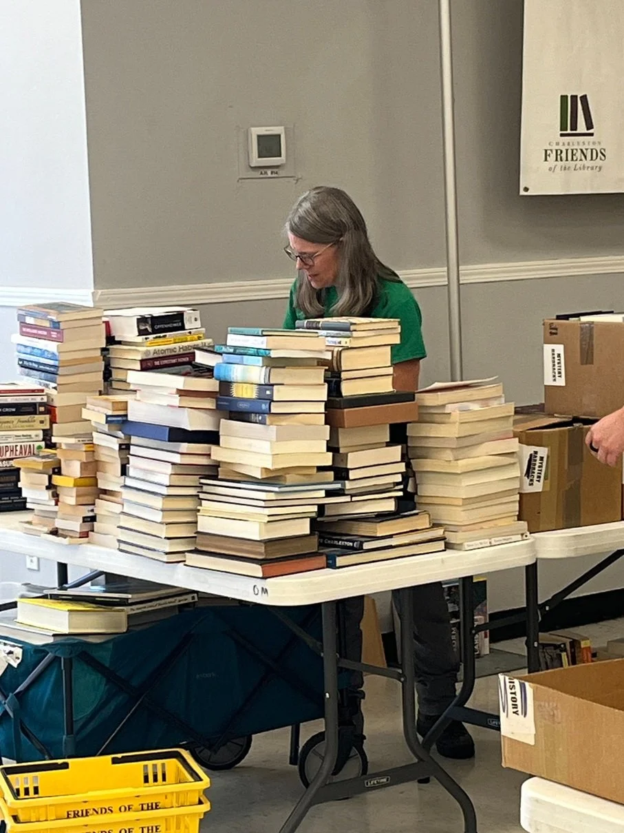 Teacher and students holding books