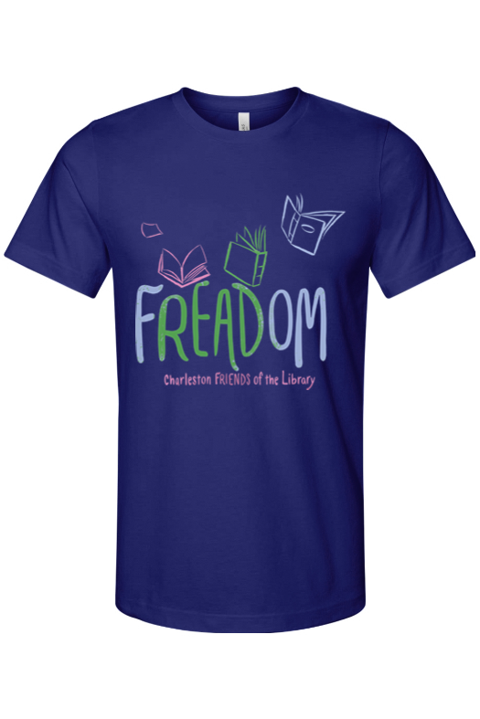 A navy blue T-shirt with colorful text and illustrations promoting a library event. The text reads 'FREEDOM' with 'Charleston FRIENDS of the Library' underneath. The design includes illustrations of open books and a reading glasses.