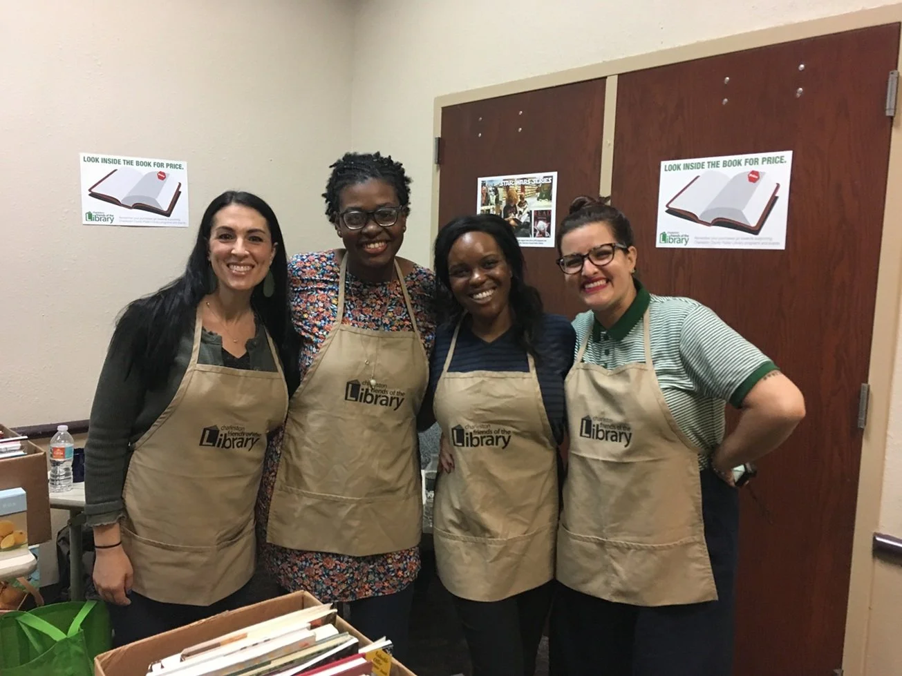 4 volunteers in aprons