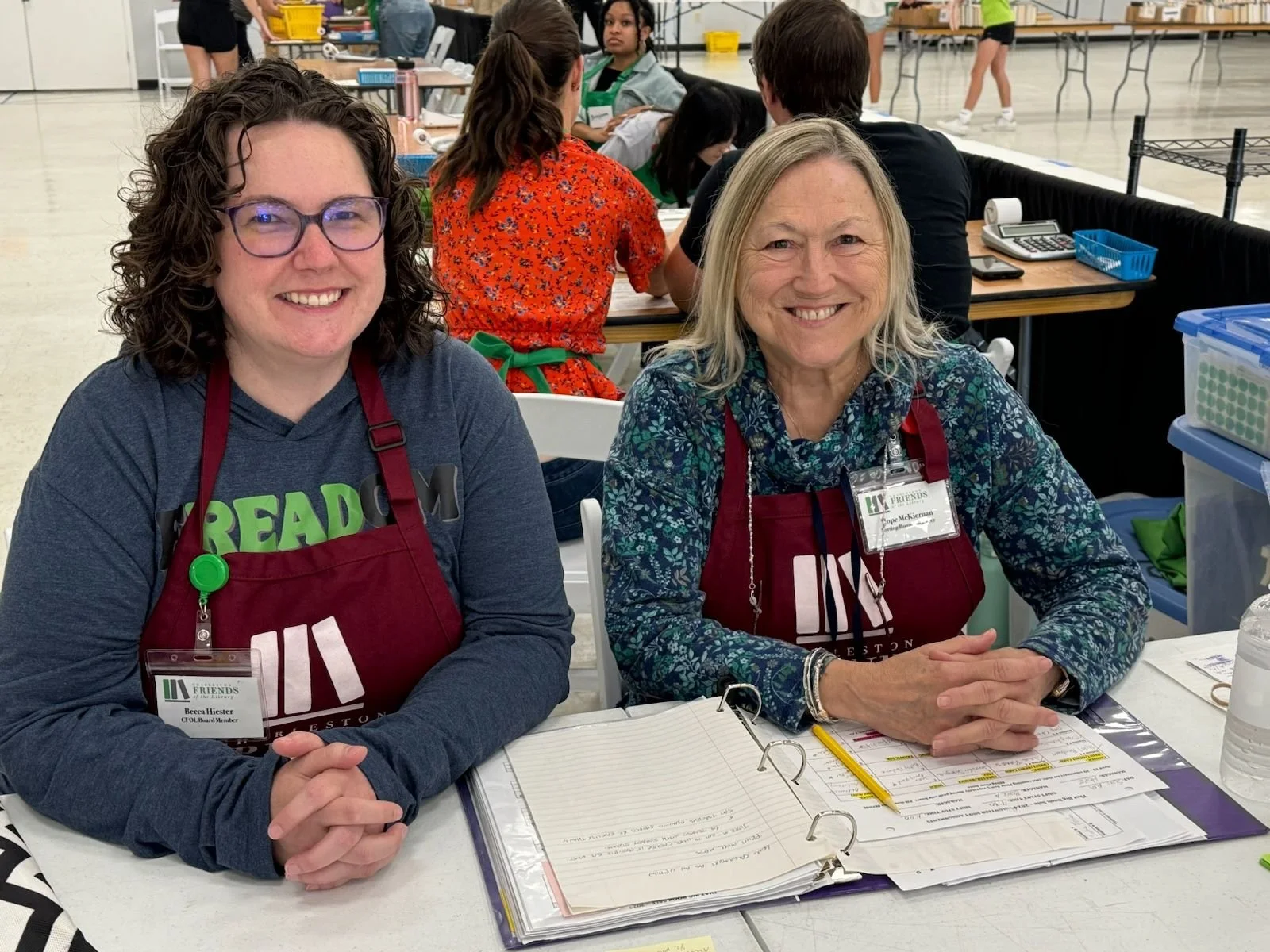 2 volunteers at desk