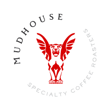 Logo with a red winged creature and text 'Mudhouse Specialty Coffee Roasters' around it.