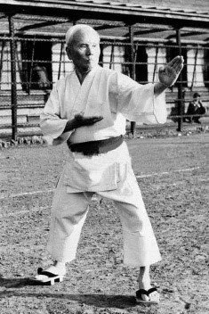 Master Gichin Funakoshi  practicing kata