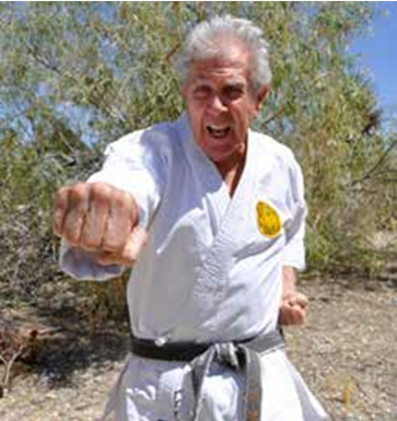 Shotokan Karate fifth degree  black belt Ken Osborne demonstrating a front punch 