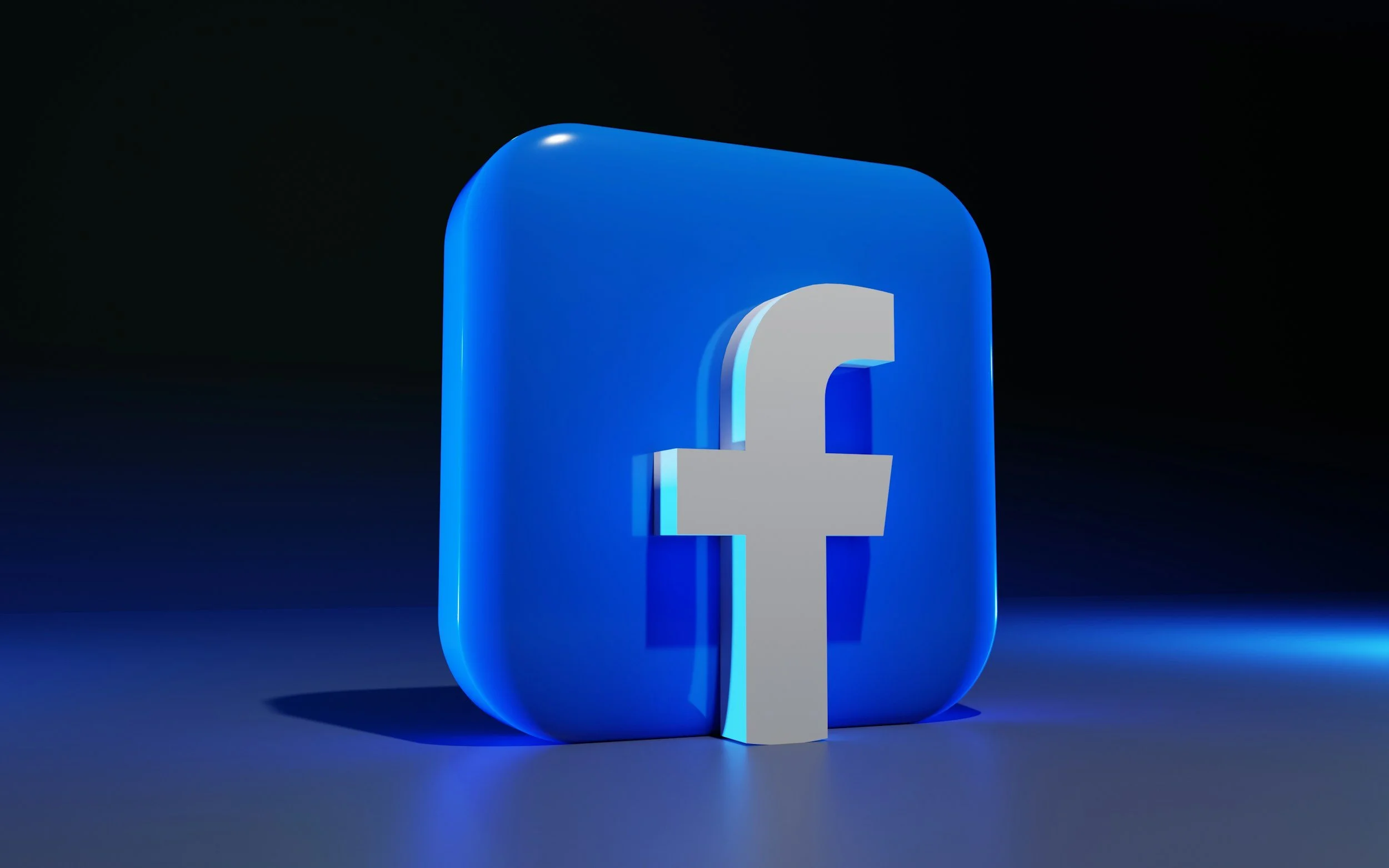 3D Facebook logo with blue background and gray lowercase 'f' symbol.