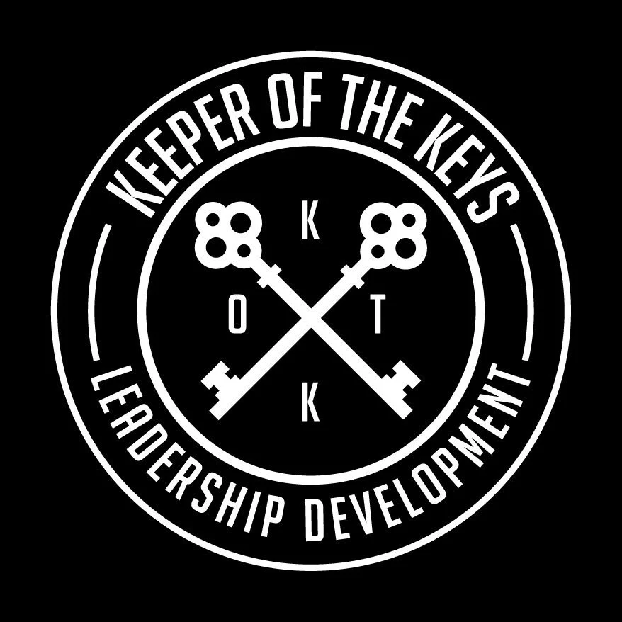 A black and white circular emblem with the text "Keeper of the Keys Leadership Development" and "Leadership Development" surrounding two crossed keys with the letters O, T, K, and K and a central "K" in the middle.
