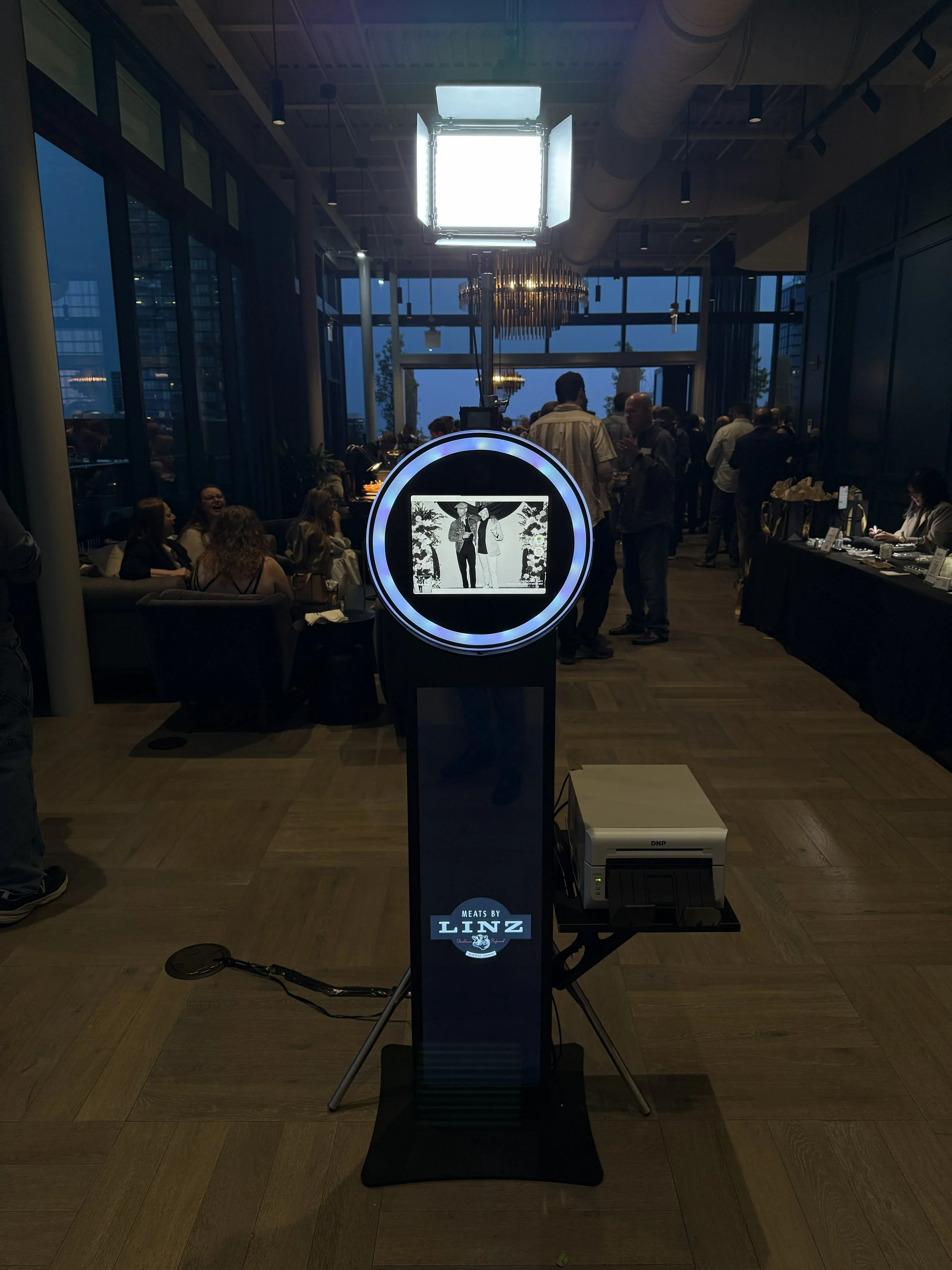 Corporate event photo booth with branded prints