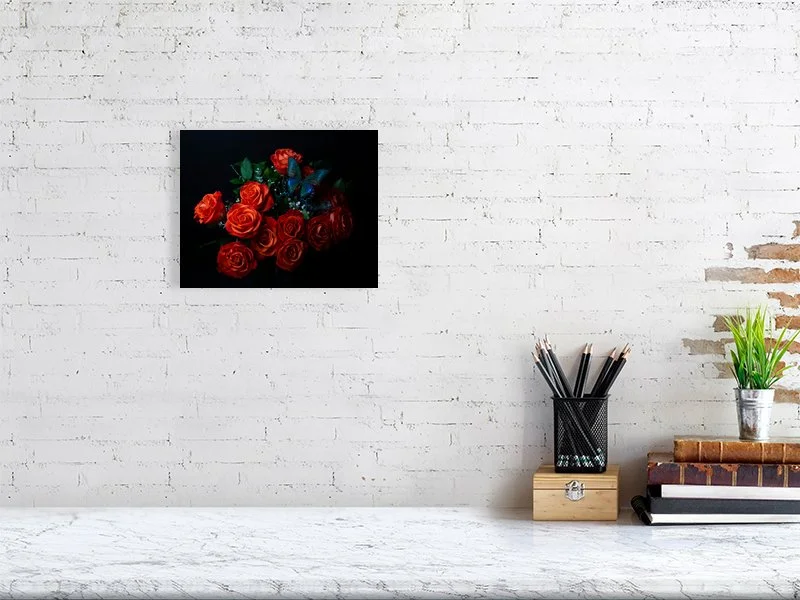 Fine art photograph of an iridescent blue butterfly perched on a bouquet of orange roses for sale sample of home decor.